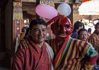 Festival clown and man. All the Bhutanese wear their traditional dress for the festival.