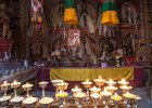 Lamps and Buddhas inside Shey Gompa