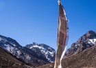 Dorje and large prayer flag outside Shey Gompa
